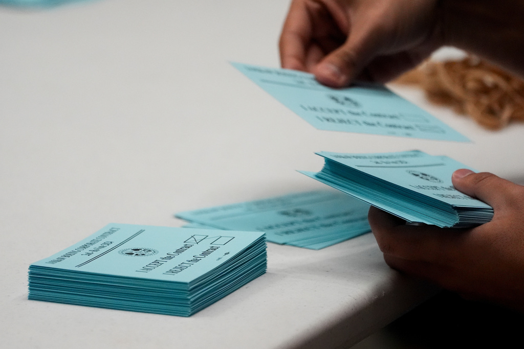 FILE - A volunteer sorts votes on a new contract offer from Boeing, Nov. 4, 2024, at the IAM District 751 Union Hall in Seattle. (AP Photo/Lindsey Wasson, File)
