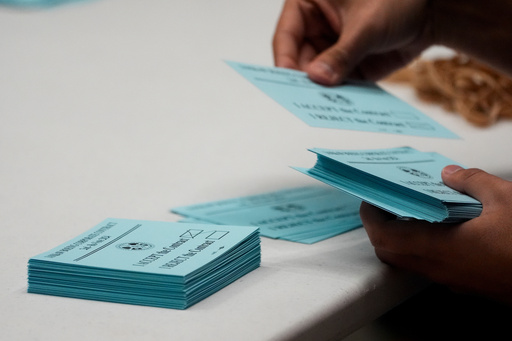FILE - A volunteer sorts votes on a new contract offer from Boeing, Nov. 4, 2024, at the IAM District 751 Union Hall in Seattle. (AP Photo/Lindsey Wasson, File) FILE - A volunteer sorts votes on a new contract offer from Boeing, Nov. 4, 2024, at the IAM District 751 Union Hall in Seattle. (AP Photo/Lindsey Wasson, File)