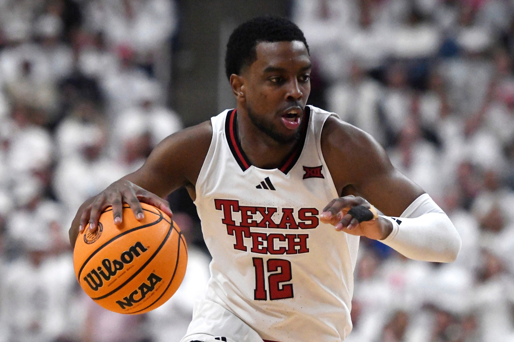Texas Tech forward Donovan Atwell dribbles during the first half of an NCAA college basketball game against Kansas, Monday, Feb. 2, 2026, in Lubbock, Texas. (AP Photo/Annie Rice)