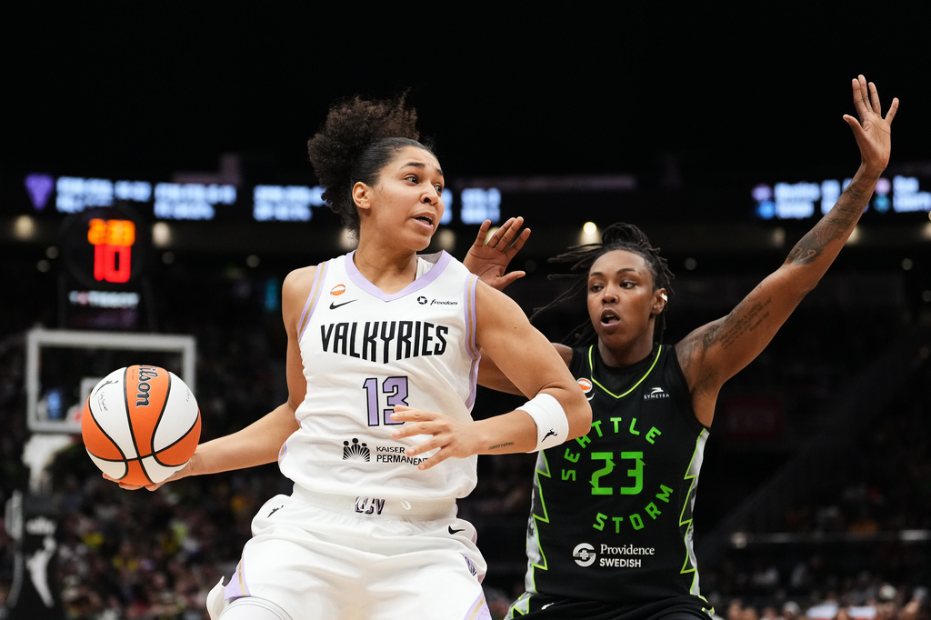 Golden State Valkyries forward Janelle Salaun (13) moves to the basket against Seattle Storm guard Jordan Horston (23) during the first half of a WNBA basketball game, Friday, May 8, 2026, in Seattle. (AP Photo/Lindsey Wasson)