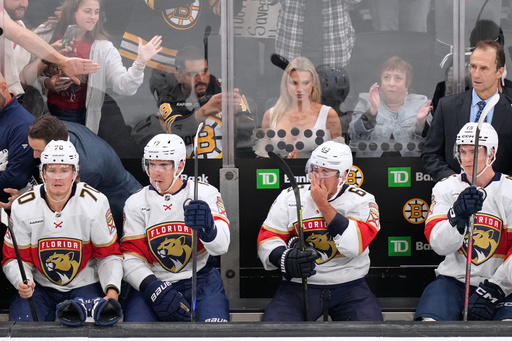 Florida Panthers left wing Brad Marchand (63), who played for more than 15 seasons with the Boston Bruins, reacts during a break in the first period of an NHL hockey game, Tuesday, Oct. 21, 2025, in Boston. (AP Photo/Charles Krupa) Florida Panthers left wing Brad Marchand (63), who played for more than 15 seasons with the Boston Bruins, reacts during a break in the first period of an NHL hockey game, Tuesday, Oct. 21, 2025, in Boston. (AP Photo/Charles Krupa)