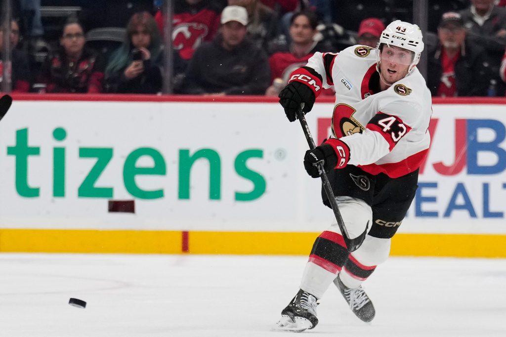 Ottawa Senators' Tyler Kleven scores on an empty net during the third period of an NHL hockey game against the New Jersey Devils in Newark, N.J., Monday, Oct. 12, 2026. (AP Photo/Seth Wenig)