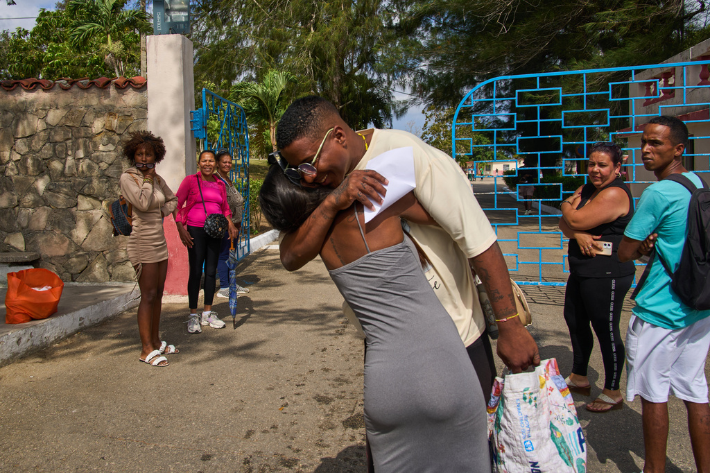A pardoned prisoner hugs a family member outside La Lima penitentiary after his release in Guanabacoa, Havana, Cuba, Friday, April 3, 2026. (AP Photo/Ramon Espinosa)
