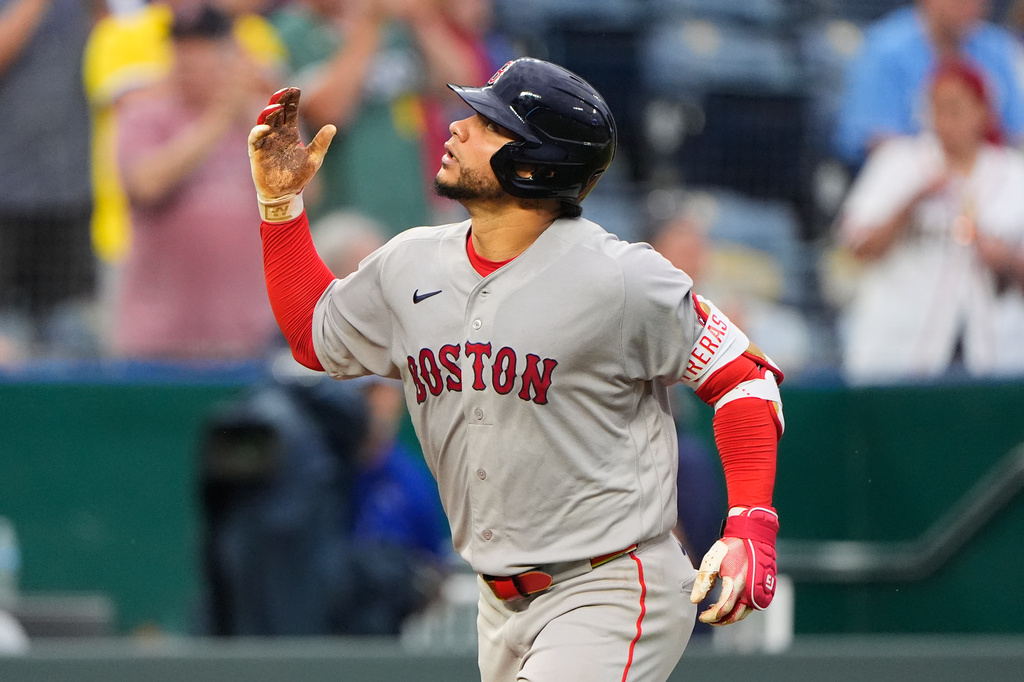 Boston Red Sox's Willson Contreras celebrates as he runs home after hitting a two-run home run during the sixth inning of a baseball game against the Kansas City Royals, Monday, May 18, 2026, in Kansas City, Mo. (AP Photo/Charlie Riedel)