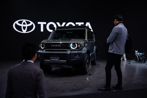 Members of the media and guests look at Toyota's Land Cruiser 'FJ' during the press day of the Japan Mobility Show, in Tokyo, Thursday, Oct. 30, 2025. (AP Photo/Louise Delmotte) Members of the media and guests look at Toyota's Land Cruiser 'FJ' during the press day of the Japan Mobility Show, in Tokyo, Thursday, Oct. 30, 2025. (AP Photo/Louise Delmotte)