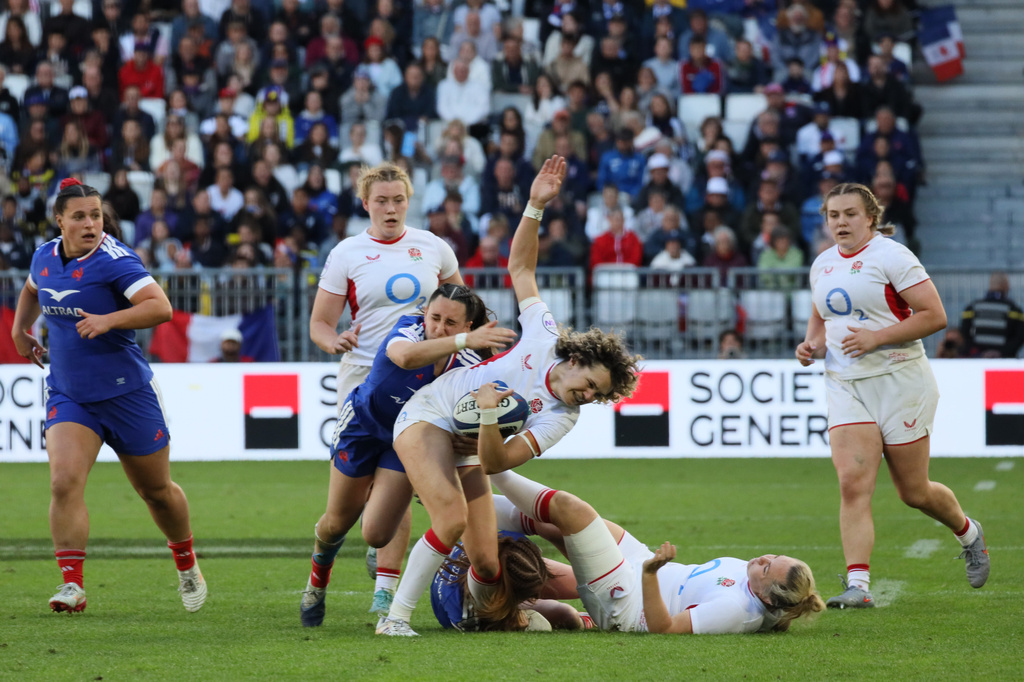 England's Ellie Kildunne is tackled during the Six Nations rugby union match between France and England in Bordeaux, Sunday, May 17, 2026. (AP Photo/Yohan Bonnet)