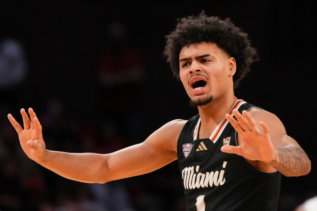 Miami (Ohio) guard Trey Perry reacts during the first half of an NCAA college basketball game against Northern Illinois, Saturday, Jan. 31, 2026, in Oxford, Ohio. (AP Photo/Jeff Dean)
