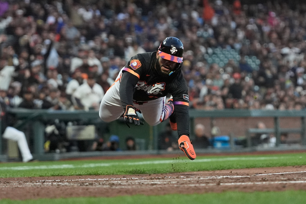San Francisco Giants' Heliot Ramos slides home to score against the Toronto Blue Jays during the fifth inning of a baseball game Tuesday, July 7, 2026, in San Francisco. (AP Photo/Jeff Chiu)