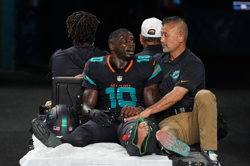 Miami Dolphins wide receiver Tyreek Hill (10) talks with a staff member as he is carted off the field after suffering an unknown lower leg injury in the second half of an NFL football game against the New York Jets, Monday, Sept. 29, 2025, in Miami Gardens, Fla. (AP Photo/Rebecca Blackwell) Miami Dolphins wide receiver Tyreek Hill (10) talks with a staff member as he is carted off the field after suffering an unknown lower leg injury in the second half of an NFL football game against the New York Jets, Monday, Sept. 29, 2025, in Miami Gardens, Fla. (AP Photo/Rebecca Blackwell)