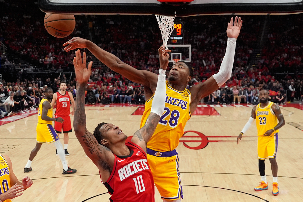 FILE - Los Angeles Lakers forward Rui Hachimura (28) blocks a shot by Houston Rockets forward Jabari Smith Jr. (10) during the first half of Game 6 of a first-round NBA playoffs basketball series in Houston, May 1, 2026. (AP Photo/Ashley Landis, File)