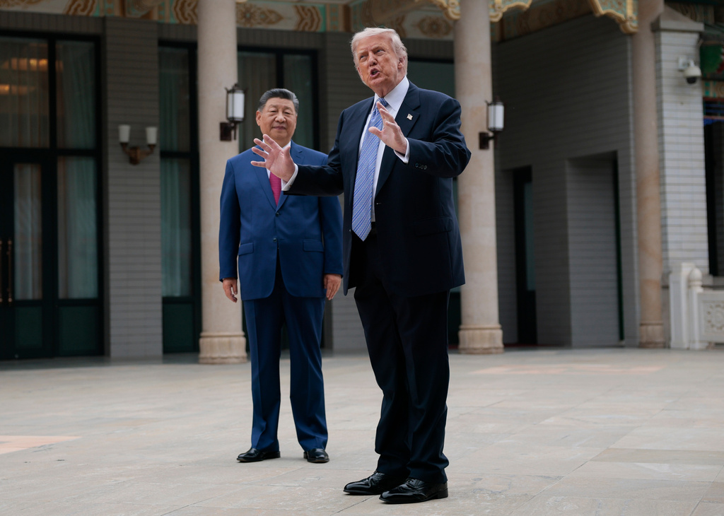 U.S. President Donald Trump, right, gestures as he speaks next to Chinese President Xi Jinping during a visit to the Zhongnanhai Garden in Beijing, China, Friday, May 15, 2026. (Evan Vucci/Pool Photo via AP)