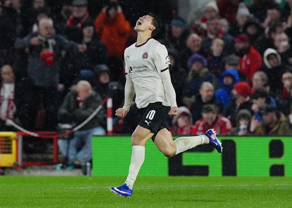 Midtjylland's Gue-Sung Cho celebrates scoring their first goal of the game during the Europa League round of 16, first leg soccer match between Nottingham Forest and FC Midtjylland in Nottingham, England, Thursday March 12, 2026. (Jacob King/PA via AP)