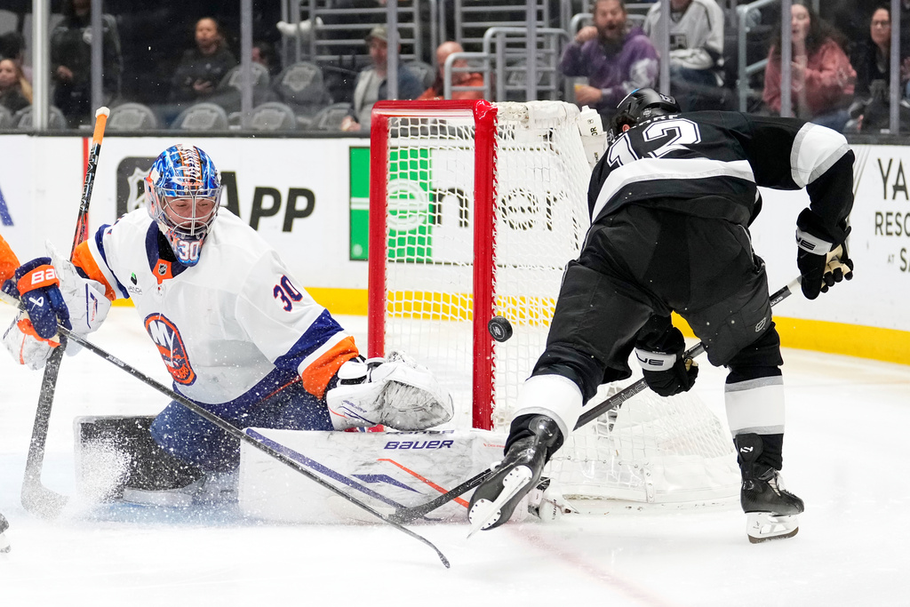 Los Angeles Kings left wing Trevor Moore, right, tries to get a shot past New York Islanders goaltender Ilya Sorokin during the second period of an NHL hockey game Thursday, March 5, 2026, in Los Angeles. (AP Photo/Mark J. Terrill)