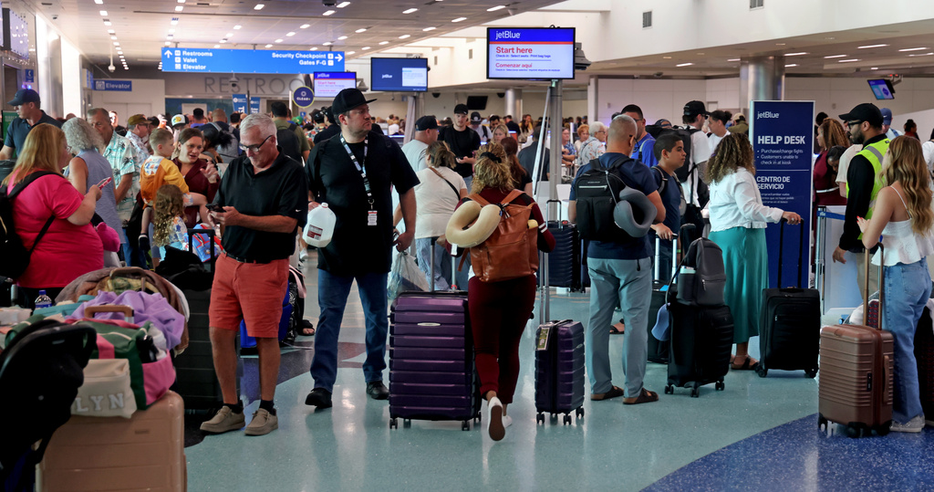 Passengers line up in Terminal 3 for JetBlue flights at Fort Lauderdale-Hollywood International Airport on Saturday, May 2, 2026. (Mike Stocker /South Florida Sun-Sentinel via AP)