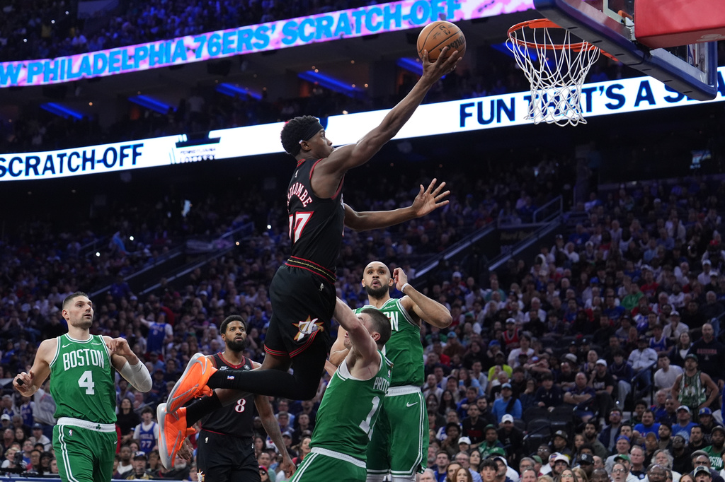 Philadelphia 76ers' VJ Edgecombe (77) goes up for a shot against Boston Celtics' Payton Pritchard (11) during the second half of Game 3 in a first-round NBA playoffs basketball series Friday, April 24, 2026, in Philadelphia. (AP Photo/Matt Slocum)