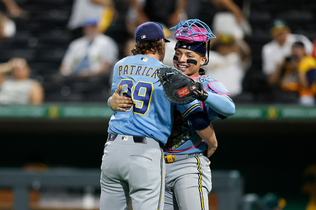Milwaukee Brewers relief pitcher Chad Patrick (39) and catcher William Contreras (24) following the Brewers' victory over the Athletics Monday, June 8, 2026, in Las Vegas. (AP Photo/Caroline Brehman)