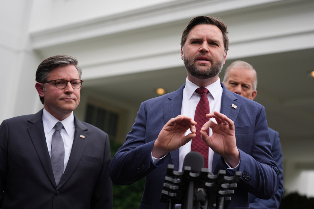 Vice President JD Vance, right, and House Speaker Mike Johnson, R-La., speak to members of the media outside the West Wing at the White House in Washington, Monday, Sept. 29, 2025, in Washington. (AP Photo/Evan Vucci)