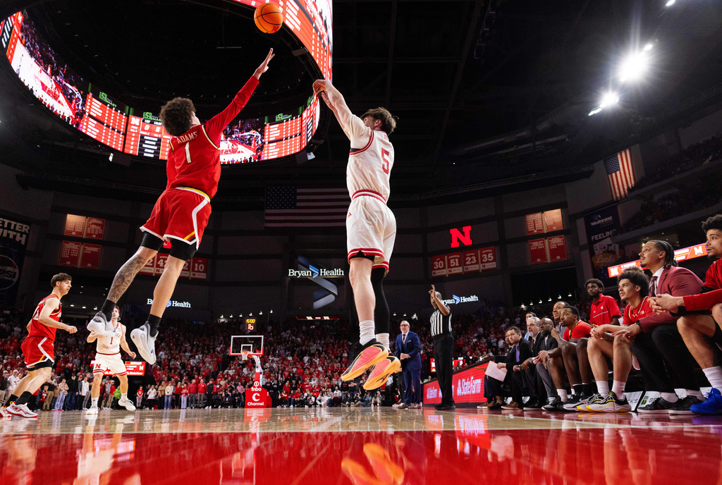 Nebraska's Braden Frager (5) shoots a three point shot against Maryland's Darius Adams (1) during the first half of an NCAA college basketball game Wednesday, Feb. 25, 2026, in Lincoln, Neb. (AP Photo/Rebecca S. Gratz)