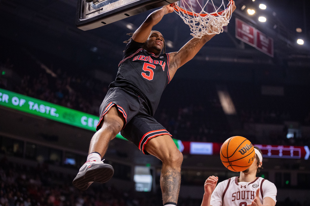 Georgia guard Jeremiah Wilkinson (5) dunks against the South Carolina during the first half of an NCAA college basketball game Saturday, Jan. 10, 2026, in Columbia, S.C. (AP Photo/Scott Kinser)
