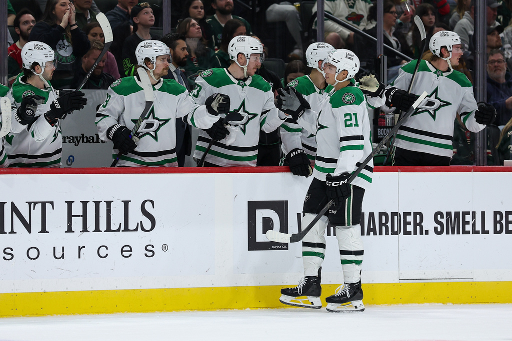 Dallas Stars left wing Jason Robertson (21) celebrates after his goal against the Minnesota Wild during the first period of an NHL hockey game Saturday, March 21, 2026, in St. Paul, Minn. (AP Photo/Matt Krohn)