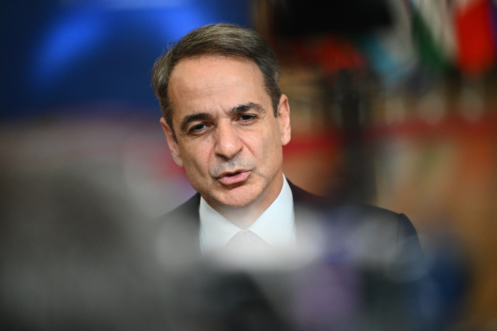 Greece's Prime Minister Kyriakos Mitsotakis speaks with the media as he arrives for the EU summit in Brussels, Thursday, Jan. 22, 2026. (AP Photo/Harry Nakos)
