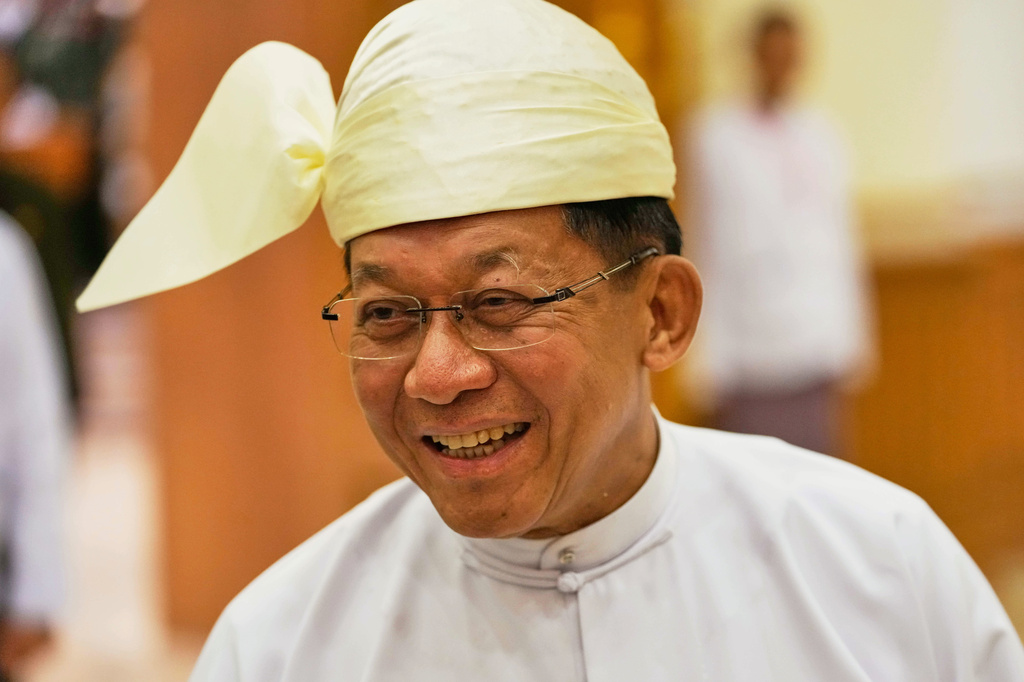 Myanmar's newly elected President Min Aung Hlaing talks to journalists as he leaves after a swearing-in ceremony at Union Parliament in Naypyitaw, Myanmar, Friday, April 10, 2026. (AP Photo/Aung Shine Oo)