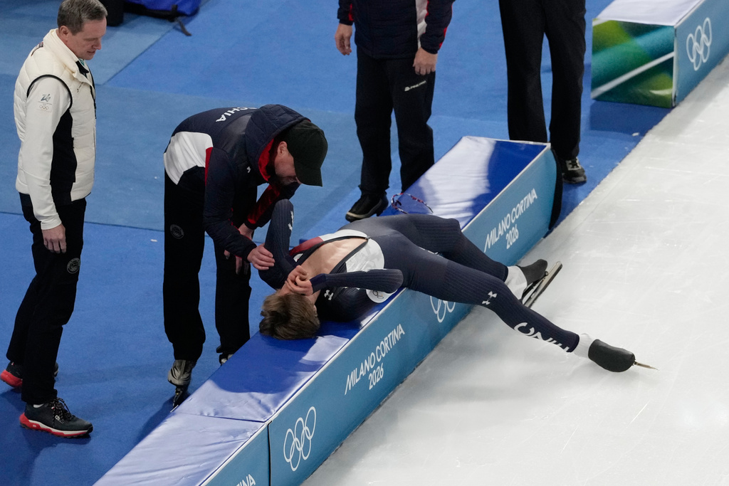 Czechia's Metodej Jilek lies on the pads after competing in the men's 10,000-meters speedskating final at the 2026 Winter Olympics, in Milan, Italy, Friday, Feb. 13, 2026. (AP Photo/David J. Phillip)