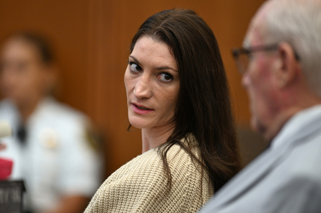 FILE - Lindsay Clancy, center, speaks with her lawyer Kevin Reddington during proceedings in her murder trial, Aug. 20, 2026, in Plymouth, Mass. (AP Photo/Josh Reynolds, Pool, File)