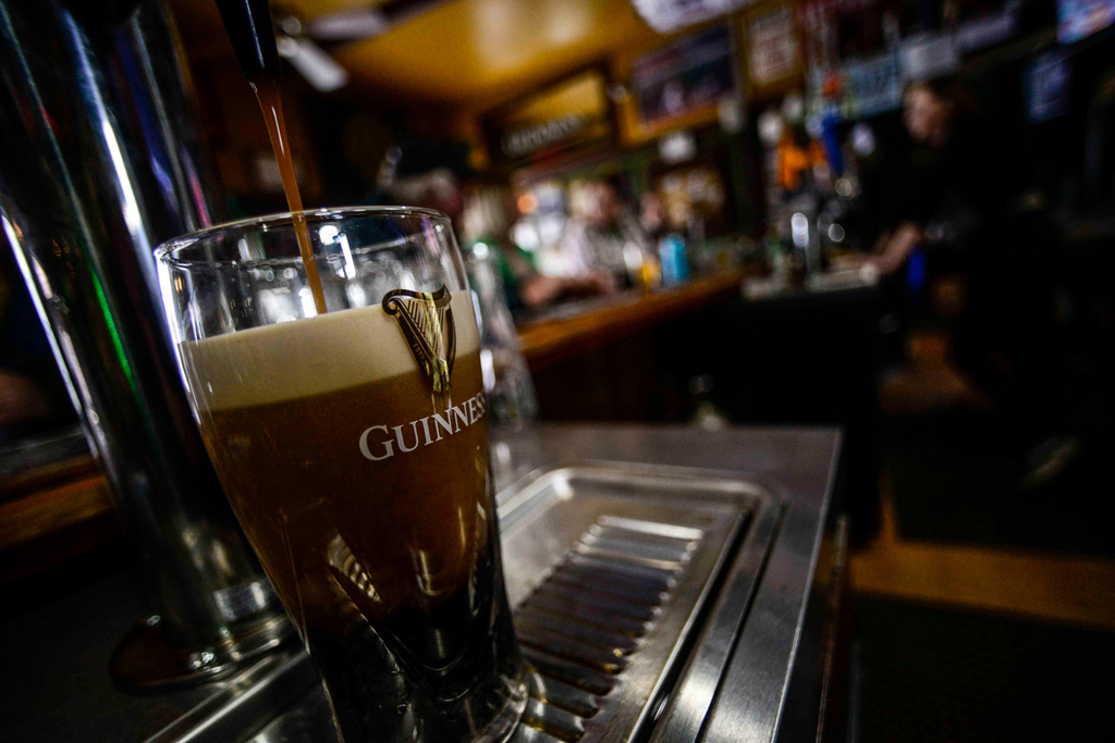 FILE - A pint of Guinness beer is poured on St. Patrick's Day on March 17, 2023, in Bellows Falls, Vt. (Kristopher Radder/The Brattleboro Reformer via AP, File)