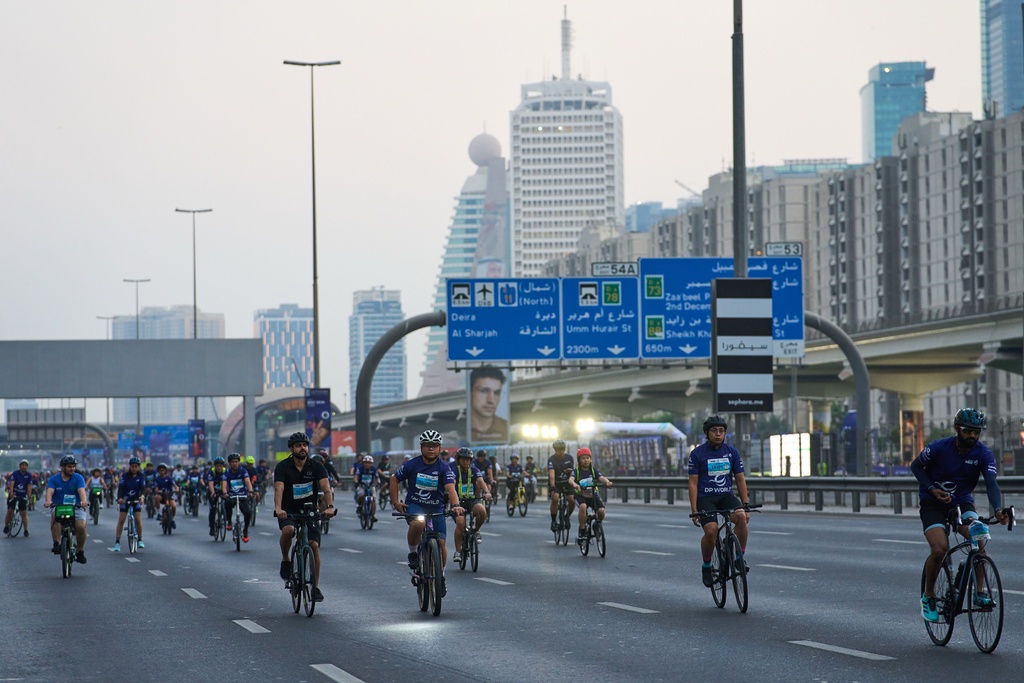 Bicyclists ride along Sheikh Zayed highway during the Dubai Ride annual event in Dubai, United Arab Emirates, Sunday, Nov. 2, 2025. (AP Photo/ Fatima Shbair)
