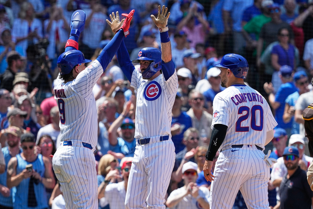 Chicago Cubs' Dansby Swanson, center, celebrates with Miguel Amaya, left, and Michael Conforto after hitting a three-run home run during the third inning of a baseball game against the San Diego Padres in Chicago, Wednesday, July 1, 2026. (AP Photo/Nam Y. Huh)