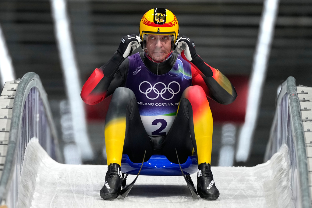 Germany's Felix Loch reacts as he arrives at the finish during a men's single luge run at the 2026 Winter Olympics, in Cortina d'Ampezzo, Italy, Sunday, Feb. 8, 2026. (AP Photo/Aijaz Rahi)