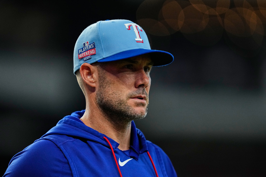 Texas Rangers manager Skip Schumaker walks to the dugout after making roster changes in the seventh inning of a baseball game against the Los Angeles Angels Sunday, Aug. 23, 2026, in Arlington, Texas. (AP Photo/Tony Gutierrez)
