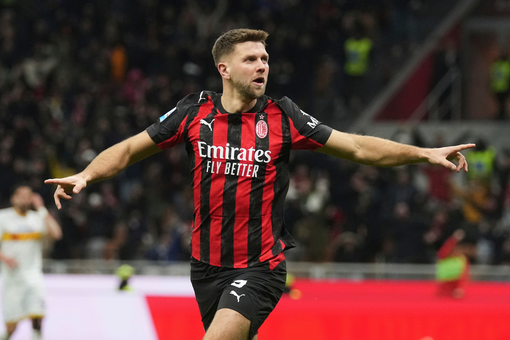 AC Milan's Niclas Fullkrug celebrates after scoring his side's first goal during the Serie A soccer match between AC Milan and Lecce in Milan, Italy, Sunday, Jan. 18, 2026. (AP Photo/Antonio Calanni)