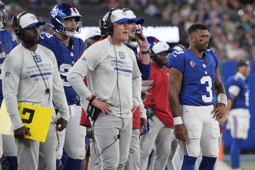 New York Giants quarterback Russell Wilson (3) watches play from the sidelines during the third quarter of an NFL football game against the New York Jets, Saturday, Aug. 16, 2025, in East Rutherford, N.J. (AP Photo/Pamela Smith)