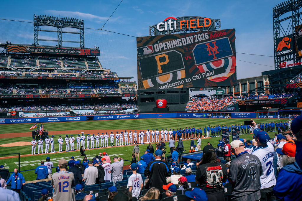 Players line up for introductions during an opening-day baseball game between the New York Mets and the Pittsburgh Pirates, Thursday, March 26, 2026, in New York. (AP Photo/Angelina Katsanis)