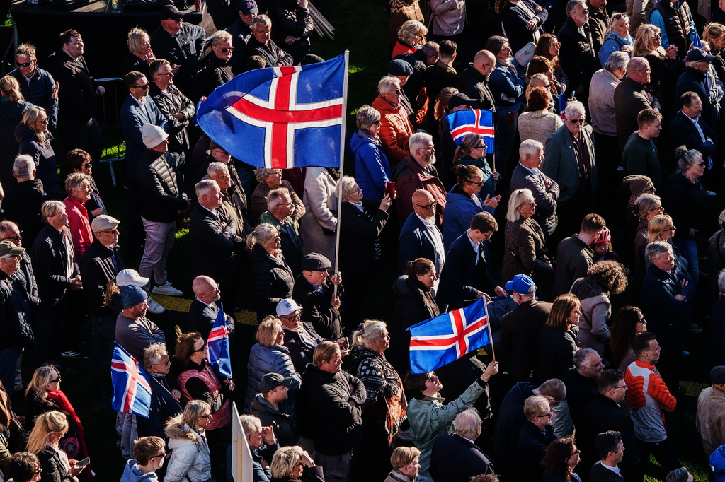 People with Icelandic flags attend an "Afram Island", "Forward, Iceland", rally, opposing the resumption of European Union accession talks at Austurvollur in Reykjavik, Iceland, Thursday, Aug. 27, 2026. (AP Photo/Marco Di Marco