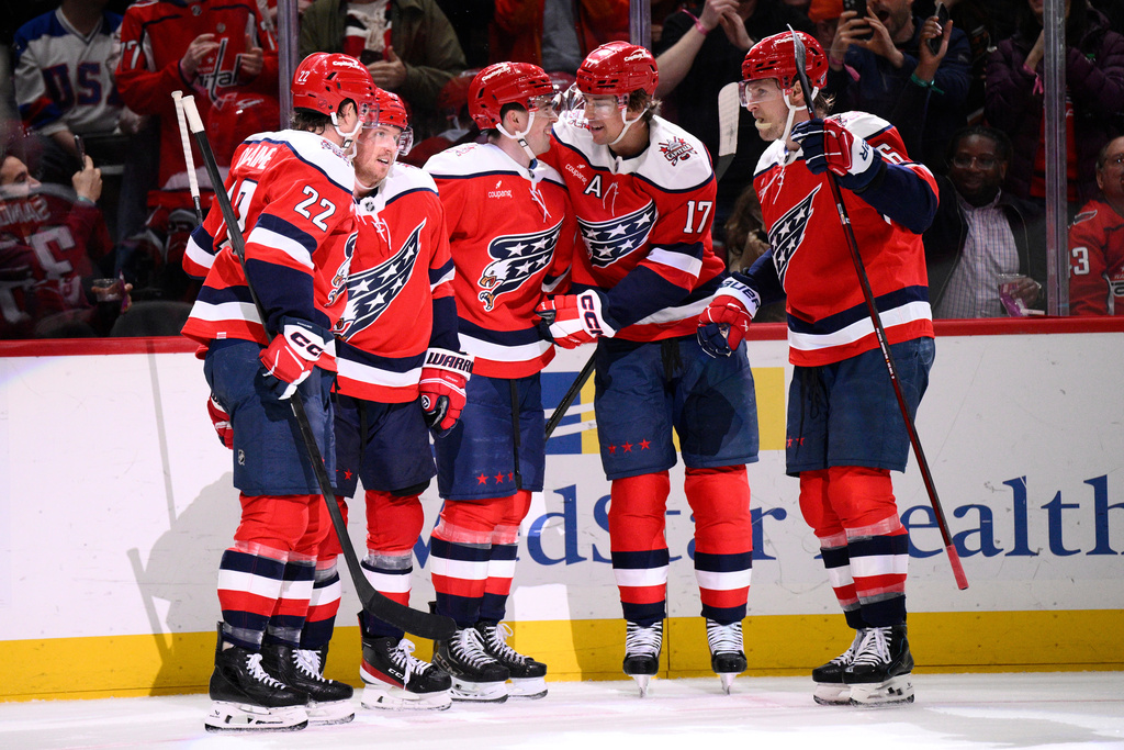 Washington Capitals defenseman Rasmus Sandin, second from left, celebrates his goal during the second period of an NHL hockey game against the Philadelphia Flyers, Wednesday, Feb. 25, 2026, in Washington. (AP Photo/Nick Wass)