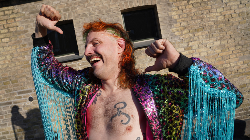 Competitor Martin Sedolf performs as character pro wrestler "Benny Bacchus", at Denmark's Mullet Championship in central Copenhagen, Saturday, June 6, 2026. (AP Photo/James Brooks)