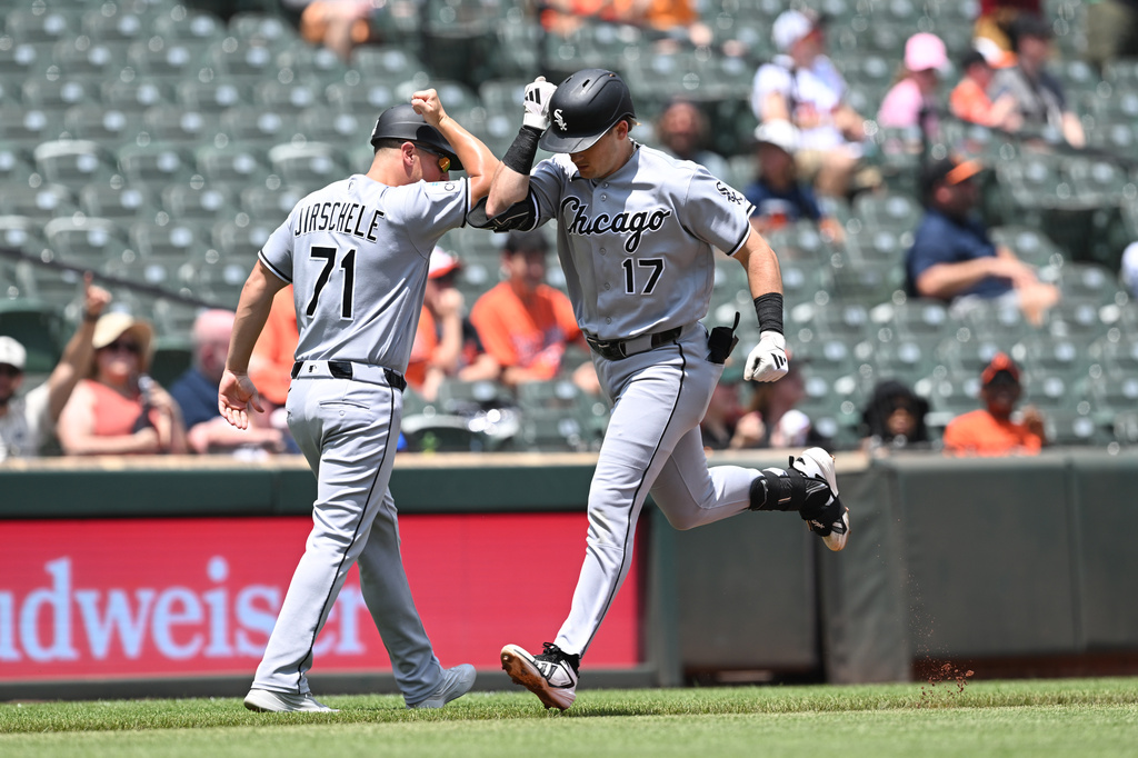 Chicago White Sox left fielder Sam Antonacci (17) is congratulated by Chicago White Sox third base coach (71) after a lead off solo home run against the Baltimore Orioles In the first inning of a baseball game, Wednesday, July 1, 2026 in Baltimore. (AP Photo/Gail Burton)