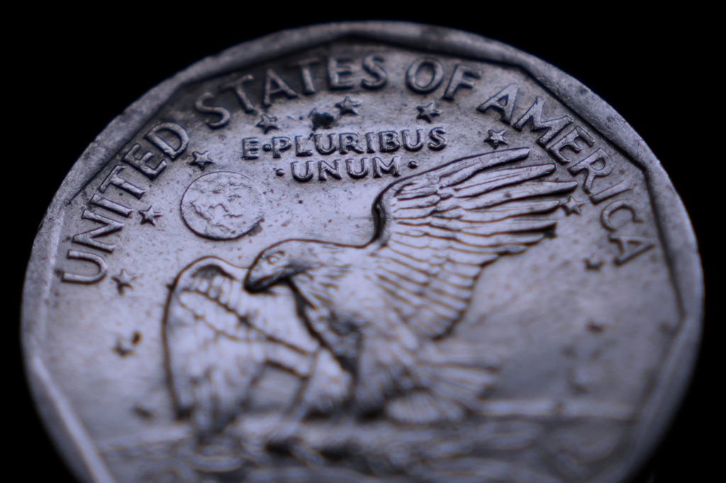 The Latin phrase "E Pluribus Unum" is seen on a one dollar coin, Monday, April 13, 2026, in Portland, Maine.(AP Photo/Robert F. Bukaty)
