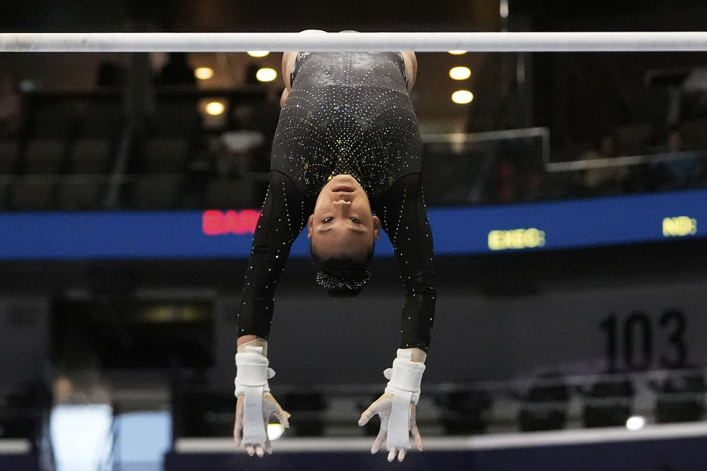 Leanne Wong of the University of Florida competes on the uneven bars during the senior women's finals of the U.S. Gymnastics Championships in New Orleans, Sunday, Aug. 10, 2025. (AP Photo/Gerald Herbert)