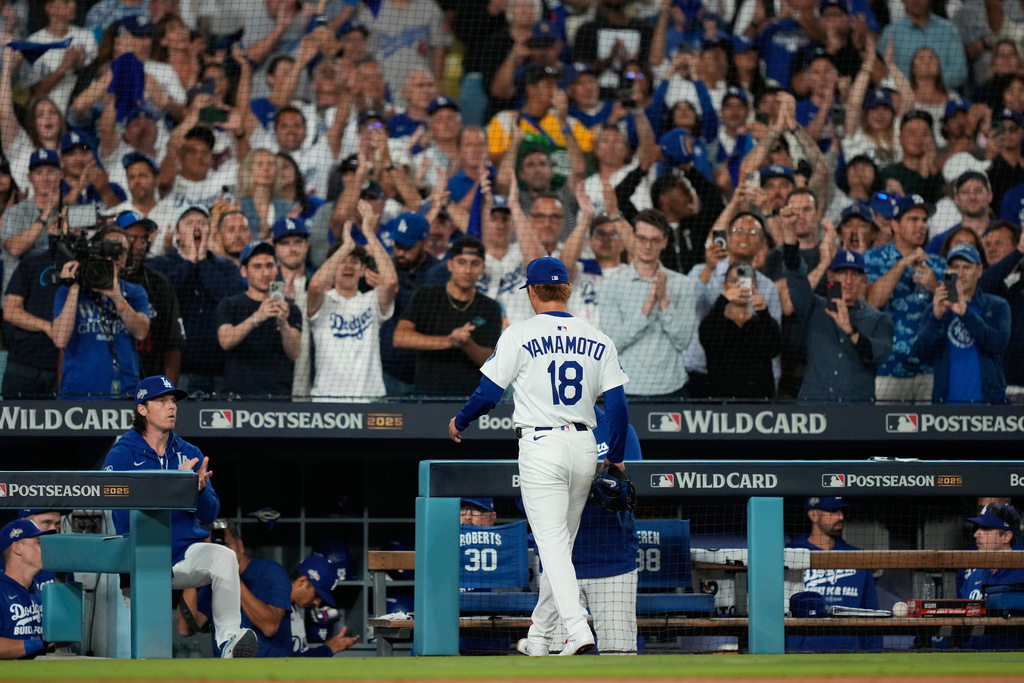 Los Angeles Dodgers starting pitcher Yoshinobu Yamamoto walks off the field after being relieved during the seventh inning in Game 2 of the National League Wild Card baseball playoff series against the Cincinnati Reds, Wednesday, Oct. 1, 2025, in Los Angeles. (AP Photo/Mark J. Terrill)