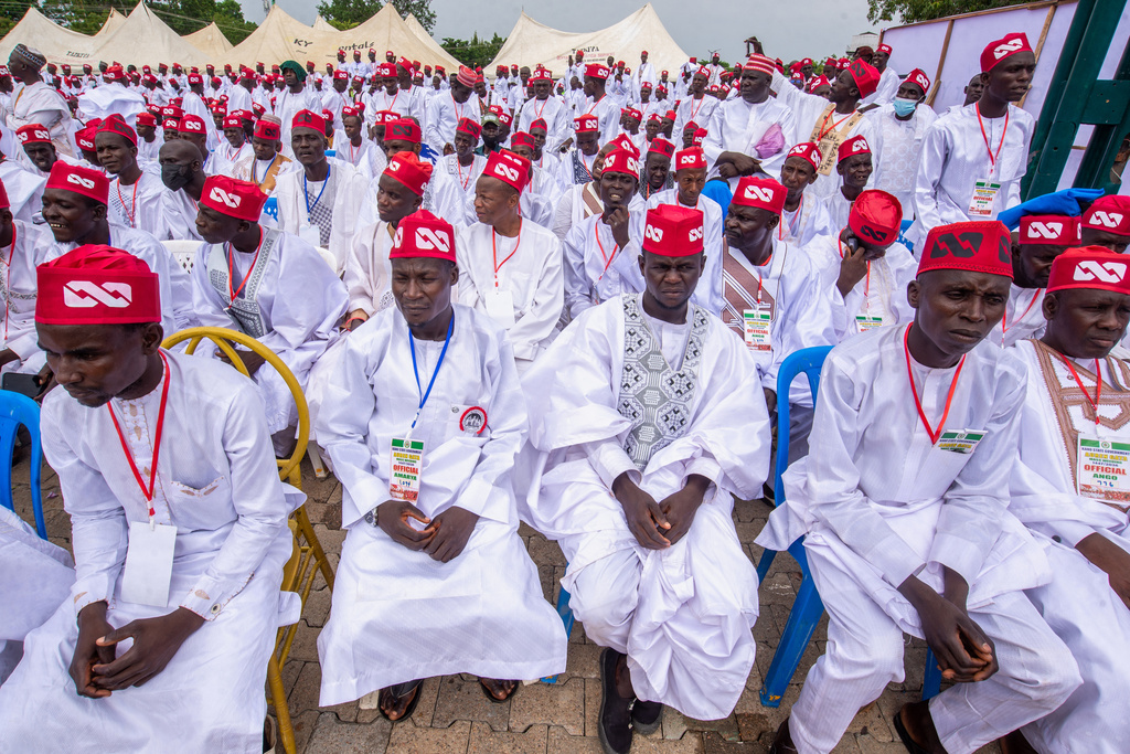 Nigerian grooms attend a mass wedding ceremony in Kano, Nigeria, Saturday, Aug. 8, 2026. (AP Photo/Sani Maikatanga)