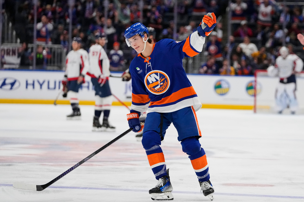 New York Islanders' Matthew Schaefer (48) celebrates after a goal he scored was reviewed during the third period of an NHL hockey game against the Washington Capitals Saturday, Oct. 11, 2025, in Elmont, N.Y. (AP Photo/Frank Franklin II)