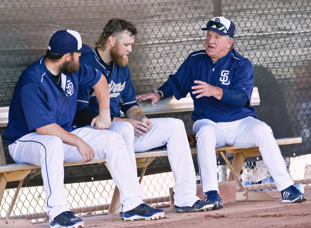 FILE - San Diego Padres catcher Derek Norris, left, pitcher Andrew Cashner, center, and former Padres' pitcher and Cy Young Award winner, Randy Jones, discuss pitching prior to a spring training baseball game against the Arizona Diamondbacks, March 21, 2015, in Peoria, Ariz. (AP Photo/Lenny Ignelzi, File)