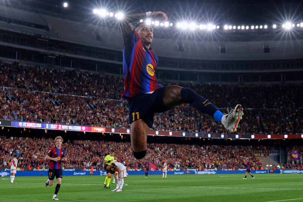 Barcelona's Raphinha celebrates after scoring his side's fourth goal during a Spanish La Liga soccer match between Barcelona and Rayo Vallecano in Barcelona, Spain, Monday, Aug. 31, 2026. (AP Photo/Joan Monfort)