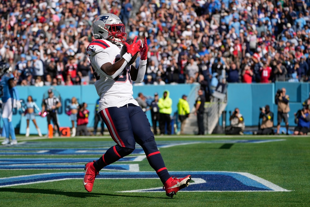 New England Patriots running back Rhamondre Stevenson (38) celebrates a touchdown during the second half of an NFL football game against the Tennessee Titans, Sunday, Oct. 19, 2025, in Nashville, Tenn. (AP Photo/George Walker IV)