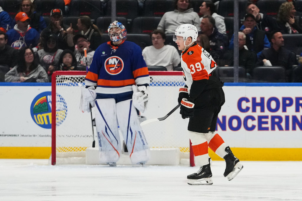 Philadelphia Flyers' Matvei Michkov (39) skates past New York Islanders goaltender Ilya Sorokin (30) after scoring a goal during the second period of an NHL hockey game Friday, April 3, 2026, in Elmont, N.Y. (AP Photo/Frank Franklin II)