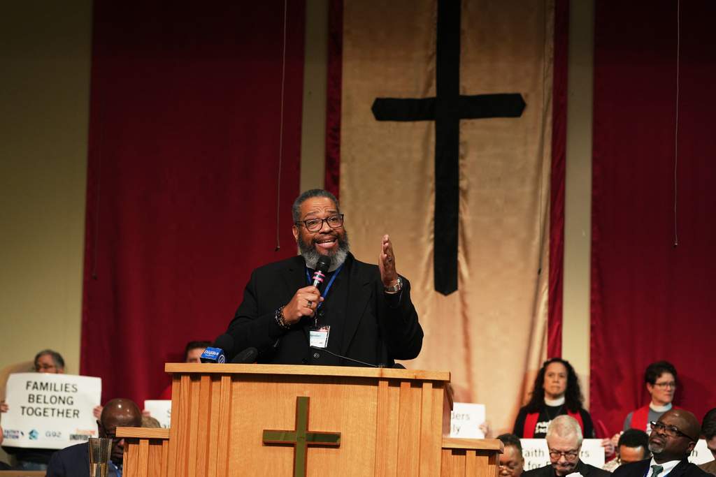 Bishop Dwayne Royster, executive director of the grassroots community organizing network, Faith in Action, addresses a crowd at St. John Missionary Baptist Church in Springfield, Ohio, on Monday, Feb. 2, 2026, during an event where dozens of faith leaders showed their support for Haitian migrants fearing the end of their Temporary Protected Status in the U.S. (AP Photo/Luis Andres Henao)